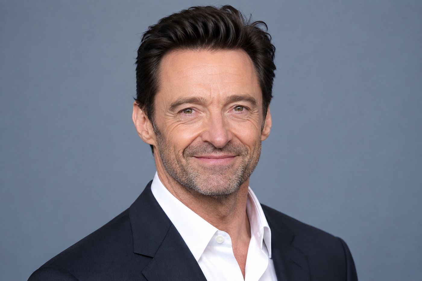 A warm birthday-themed illustration marking October 12, featuring Hugh Jackman as the day's featured Libra birthday icon.